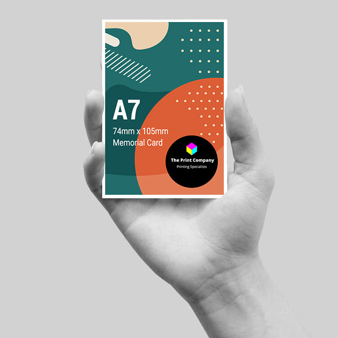 Compact A7 memorial card (74mm x 105mm) held in hand, showcasing full-colour print with tasteful design, suitable for personal remembrance cards or small tribute keepsakes.