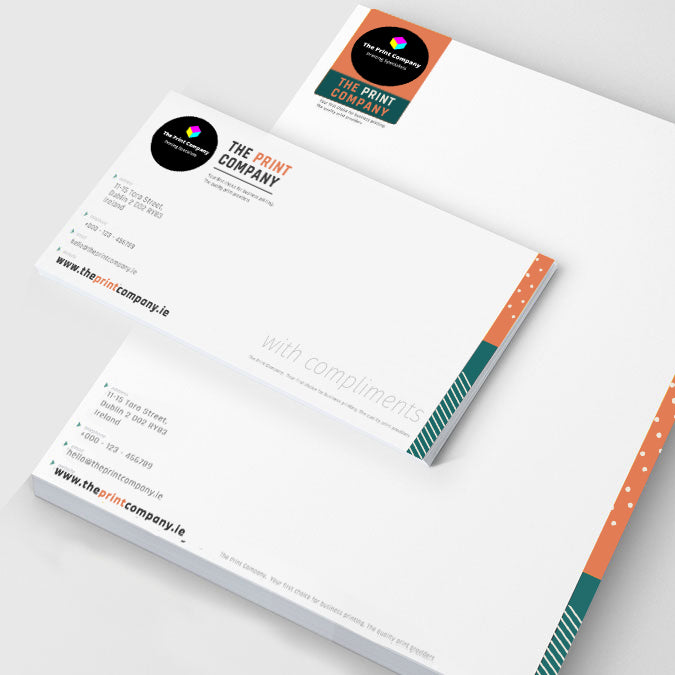 Branded corporate stationery set including letterhead and compliment slip, professionally printed with matching graphics for cohesive business identity presentation.